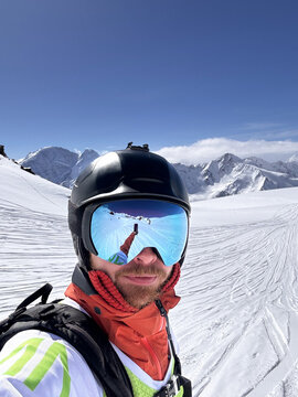 Selfie of skier with stunning alpine background