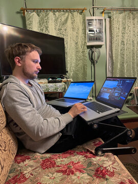 Remote video editing setup with two laptops