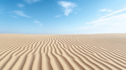 Fototapeta premium Gentle sand ridges create serene landscape under clear blue sky, evoking peace