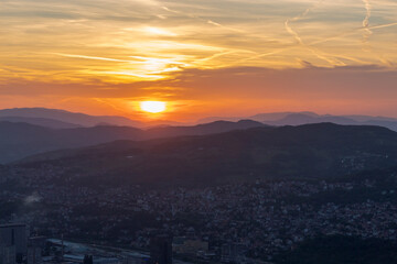 Atmospheric abstract photograph of a sunset over the natural landscapes of Bosnia and Herzegovina. Featuring vivid gradients, soft silhouettes, and warm tones that evoke emotion and tranquility