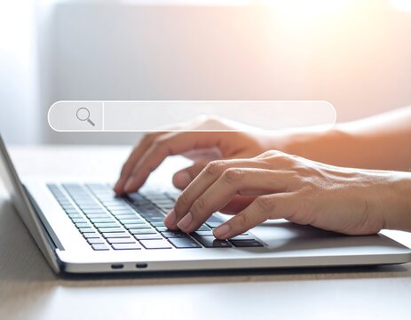 Person typing on a laptop with a digital search bar overlayed on the screen