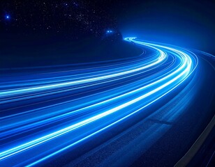 Long exposure image of a winding road at night with light trails