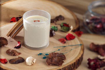 a not yet lite scented candle surround by natural dry flower