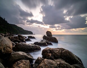 Long exposure of a rocky coastline under a dramatic cloudy sky