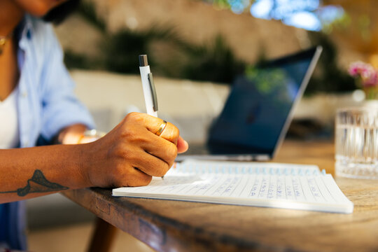 Woman writes work related notes