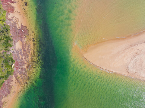 Narrow channel between a pointed beach and a rocky point
