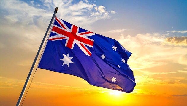 Australian flag waving in the wind during a vibrant sunset