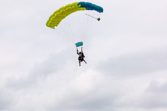 Teenage girl enjoying a tandem parachute jump