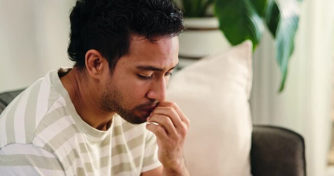 Counseling, nail bite and man on sofa with anxiety, overthinking or coping mechanism for nerves. Mental health, reflection and client in clinic for consultation, mistake or guilt in recovery.