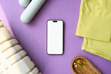 A mobile phone with white screen on a gym mat