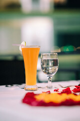 Two glasses of drink on a table