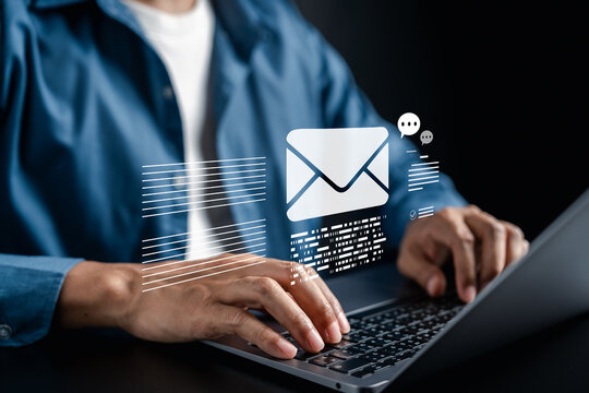 Email writing interface with digital envelope icon and text elements on laptop. online communication, email content creation, business messaging, and digital workplace interaction.