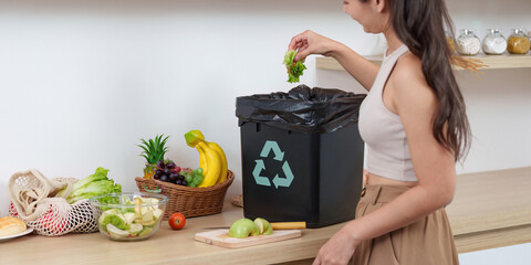 Sustainability in Action: Woman Recycling Food Waste in Kitchen