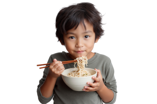 Cute young Asian boy happily eating noodles with chopsticks, isolated on transparent background