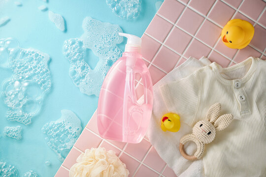 Baby bath time essentials with soap, bubbles, and toys