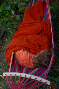 sleeping in a hammock