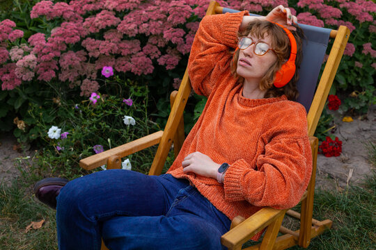 A woman enjoys listening to music