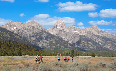 Teton Range at Grand Teton National Park with bikers enjoying the beautiful scenery, USA