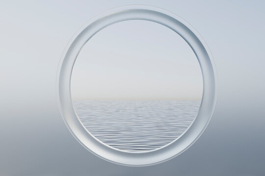 Circular porthole view of ocean on clear horizon