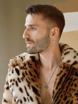Man Wearing Leopard Print Coat in Indoor Setting