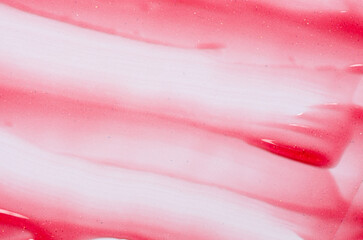 Lip oil, liquid red lipstick. Cosmetic product for lip moisturizing.