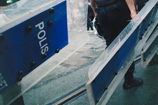 Police shields forming barricade during public event