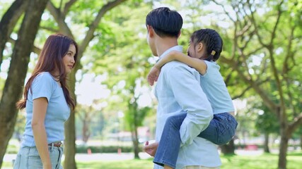 A very happy smiling family in the park - Powered by Adobe