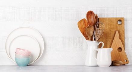 Kitchen utensils and cutting boards on table