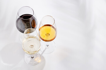 Fototapeta premium Different wine glasses on white background