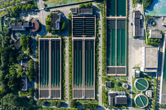 Aerial view of water treatment plant with large sedimentation tanks