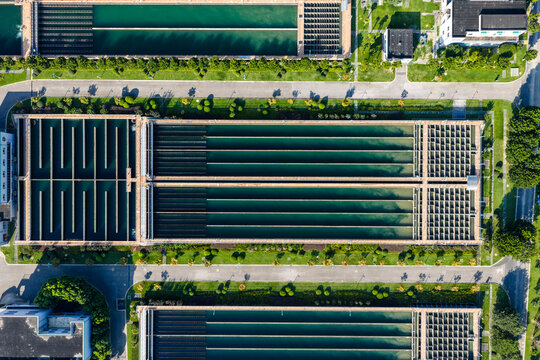 Aerial view of water treatment plant with large sedimentation tanks