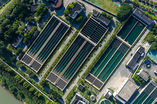 Aerial view of water treatment plant with large sedimentation tanks