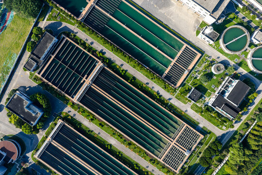Aerial view of water treatment plant with large sedimentation tanks