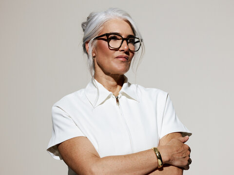 Inspirational Woman in Stylish Outfit Posing Confidently Indoors