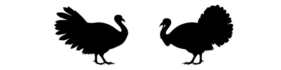 two turkey silhouettes standing in profile on a white background