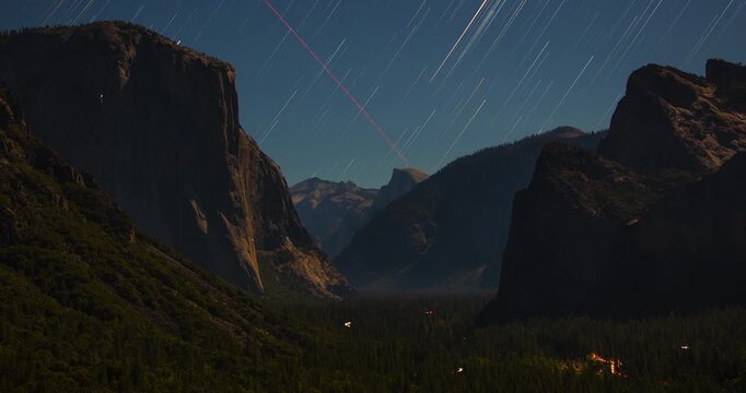 A stunning night timelapse of star trails above Tunnel View in Yosemite National Park, California. Long-exposure stars move gracefully over the iconic valley and granite peaks.