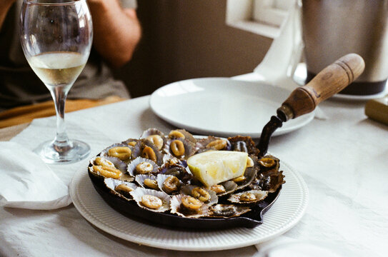 Grilled Limpets With Lemon in Cast-Iron Pan