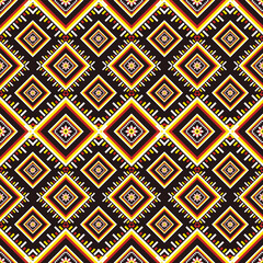Vibrant geometric ethnic pattern seamless featuring bold diamond shapes and symmetrical tribal motifs