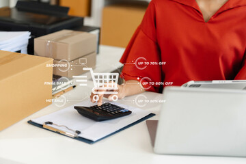 Entrepreneur using calculator in her hand, calculating financial expense at home office, online...