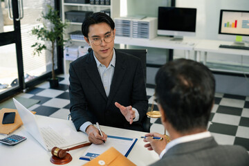 Businessman and Male lawyer or judge consult having team meeting with client, Law and Legal services concept in office.