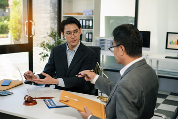 Businessman and Male lawyer or judge consult having team meeting with client, Law and Legal services concept in office.