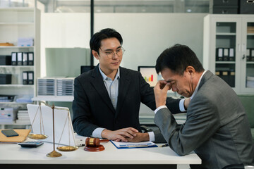 Legal advisers encourage clients. Justice and lawyer concept in the office.