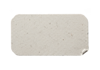 Vintage adhesive paper label with rounded corners and torn edge on black transparent background