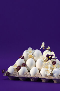 Flowered white eggs on purple backdrop