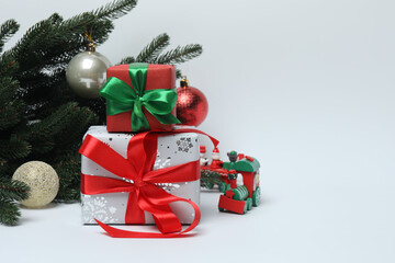 Christmas tree with toys and gifts, on a white background with space for text
