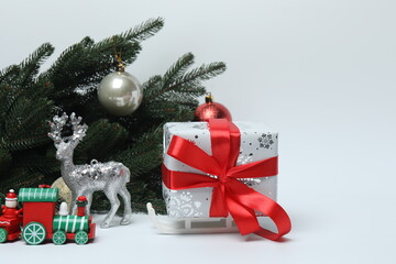 Christmas tree with toys and gifts, on a white background with space for text

