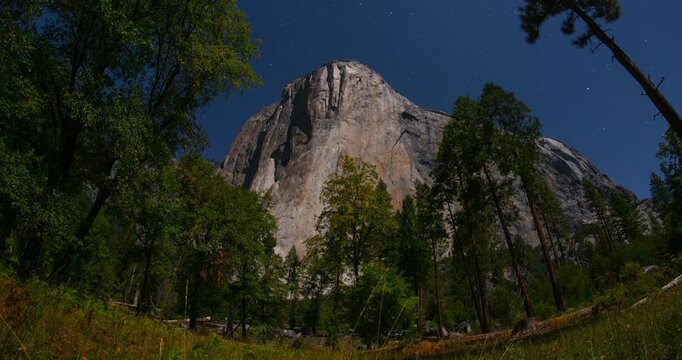 El Capitan under a bright moonlit sky in Yosemite National Park, California. Long-exposure timelapse capturing nature&rsquo;s motion over iconic granite cliff in high definition 4K. 