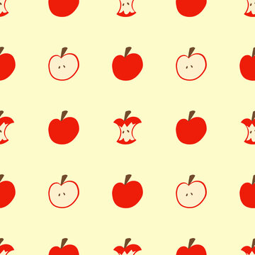A red apple pattern on a yellow wallpaper