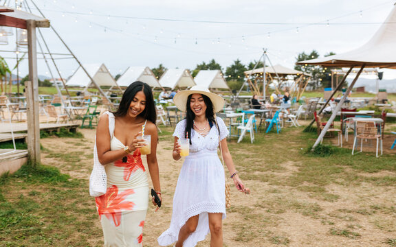Friends strolling near beach bar