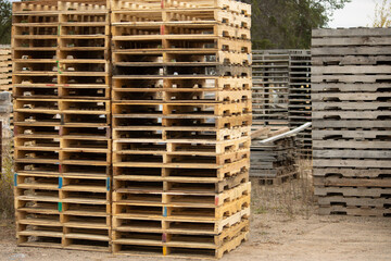 stacks of new and old wooden pallets